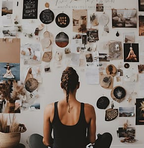 Woman Sitting in front of her Vision Board, Goal Setting